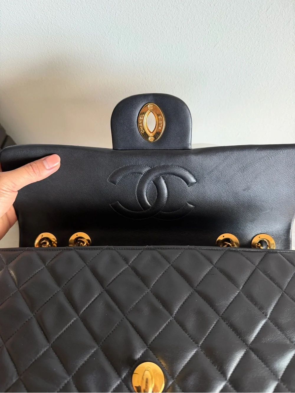 CHANEL Black Quilted Shoulder Bag with Gold Chain & CC Lock